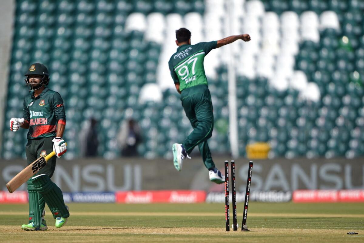 Pakistan's Haris Rauf (right) celebrates after taking the wicket of Bangladesh's Towhid Hridoy. — AFP