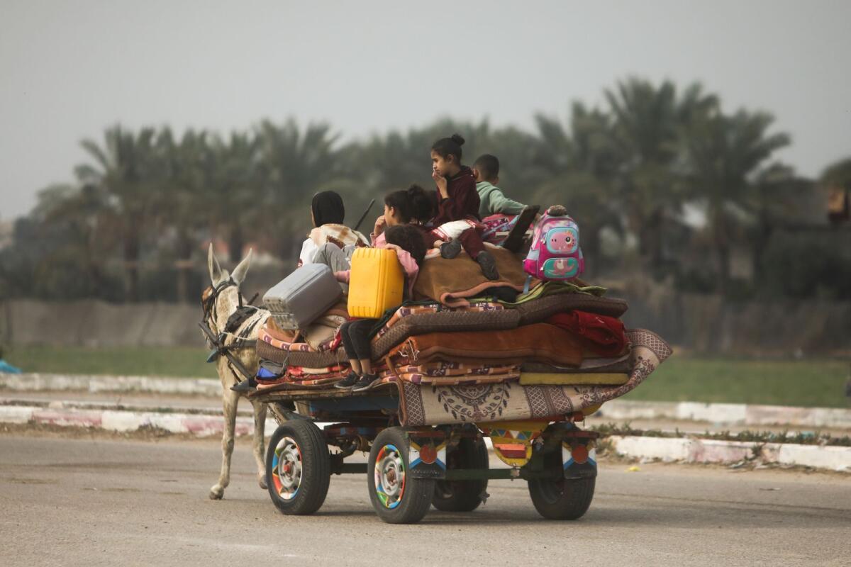 Palestinians flee the Israeli ground offensive in Khan Younis, Gaza Strip, on Wednesday. — AP
