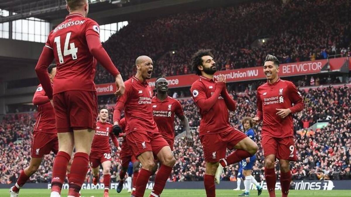Mohamed Salah (second right) celebrates with teammates after scoring a goal against Chelsea during a Premier League match last year. - AFP file