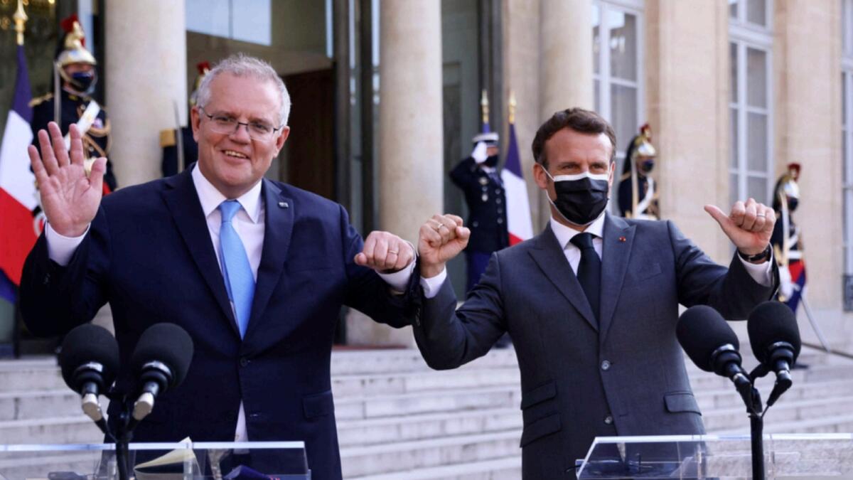 French President Emmanuel Macron (R) and Australia's Prime Minister Scott Morrison. — AFP file