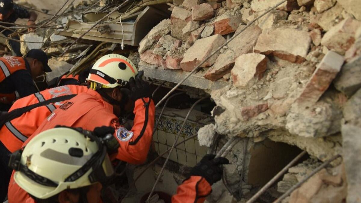 Death toll 61 in Mexico quake as hurricane hits Gulf coast 