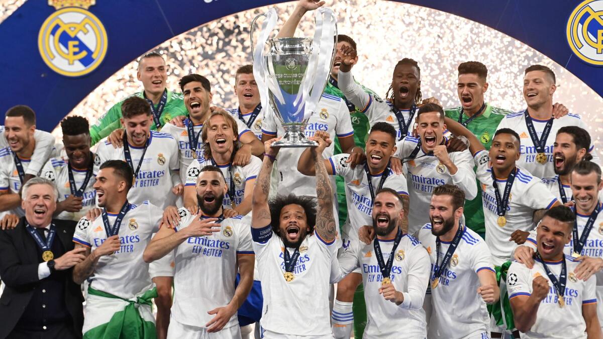 Real Madrid players celebrate with the Champions League trophy after beating Liverpool in the final. (AFP)