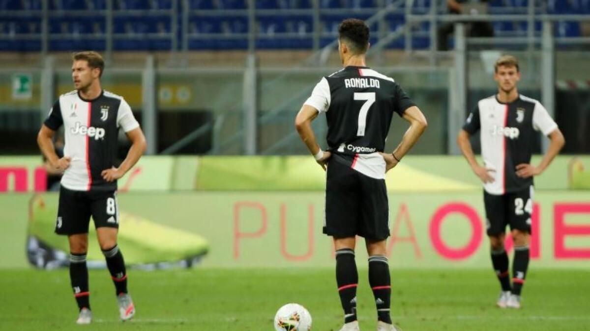 Juventus' Aaron Ramsey, Cristiano Ronaldo and Daniele Rugani look dejected after conceding a goal. (Reuters)