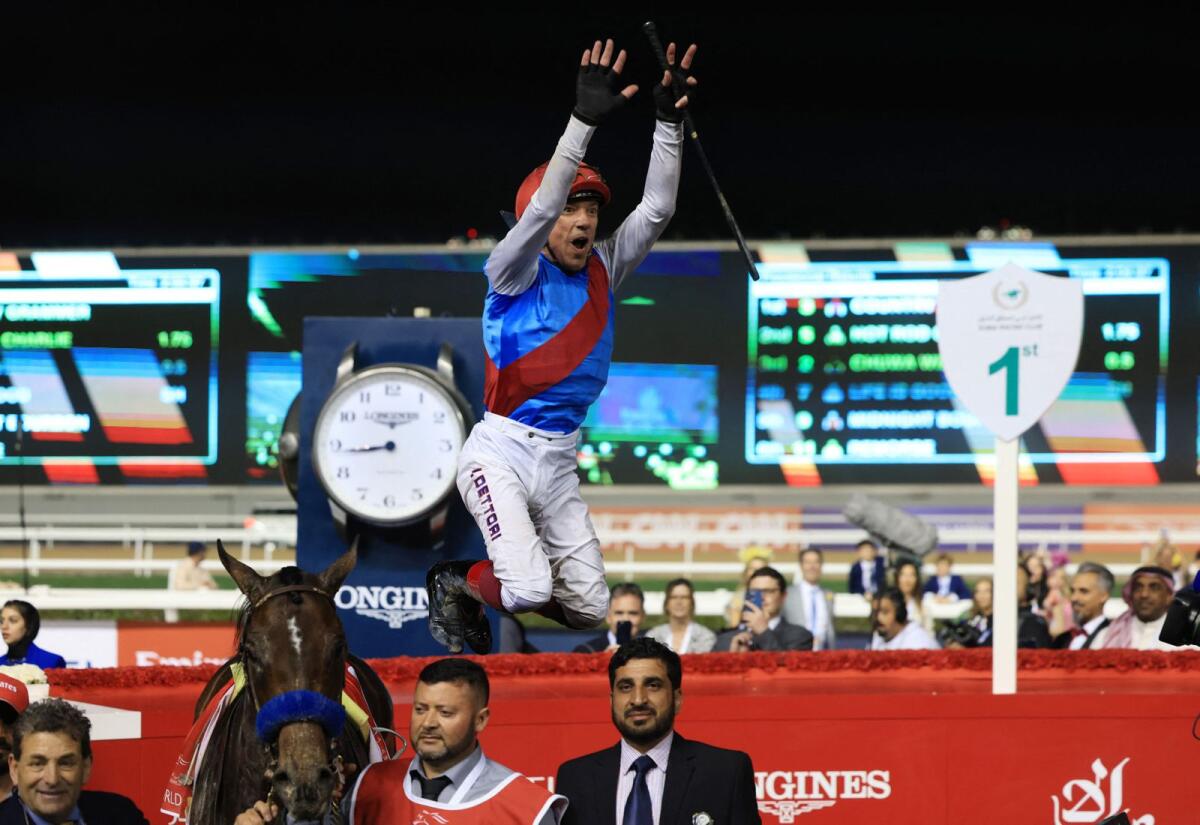 Frankie Dettori celebrates after guiding Country Grammer to victory in the Dubai World Cup last year. — Reuters