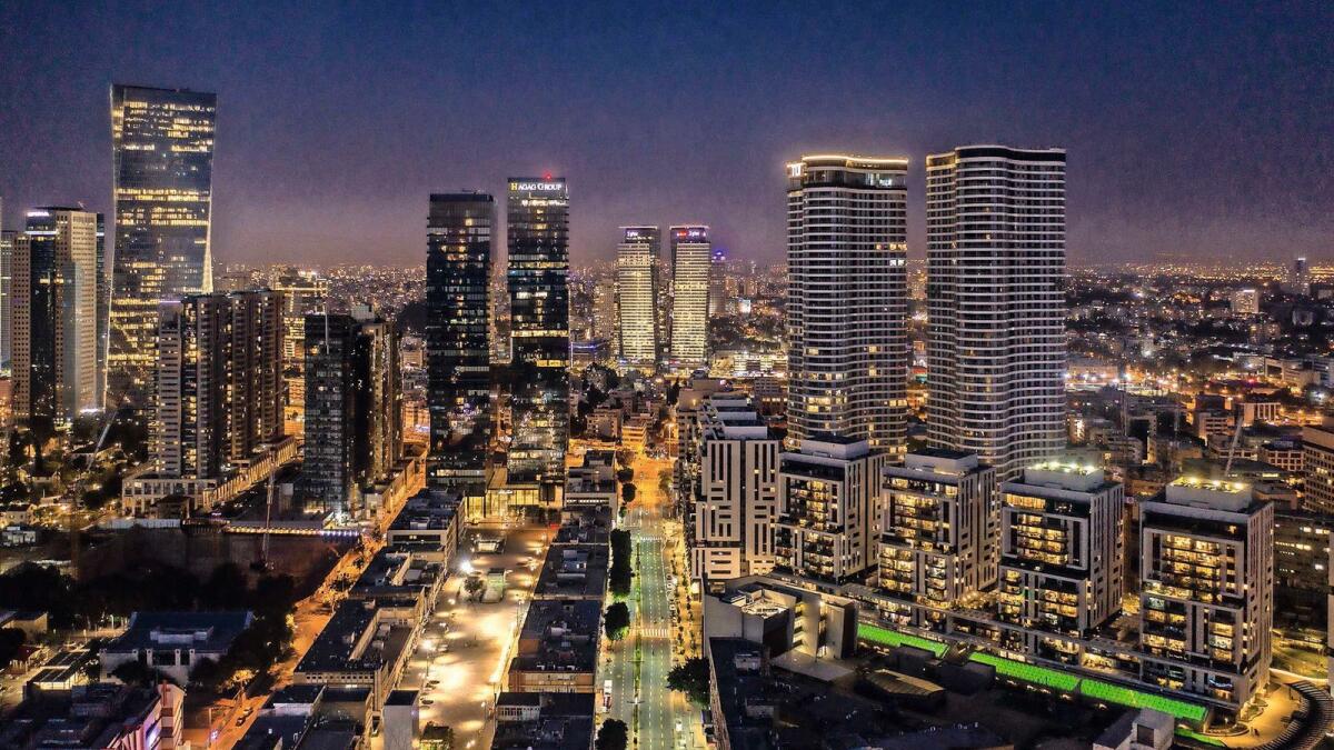 Tel Aviv skyline at night — Photo by Barak Brinker