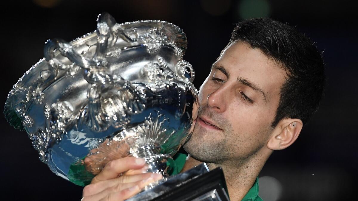 Djokovic beats Thiem in five-set epic to win eighth Australian Open