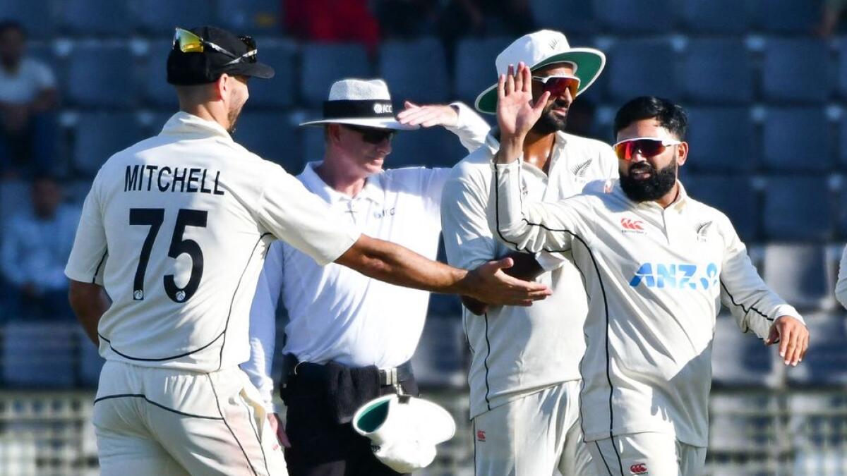 New Zealand’s Ajaz Patel (C) celebrates with teammates . - AFP