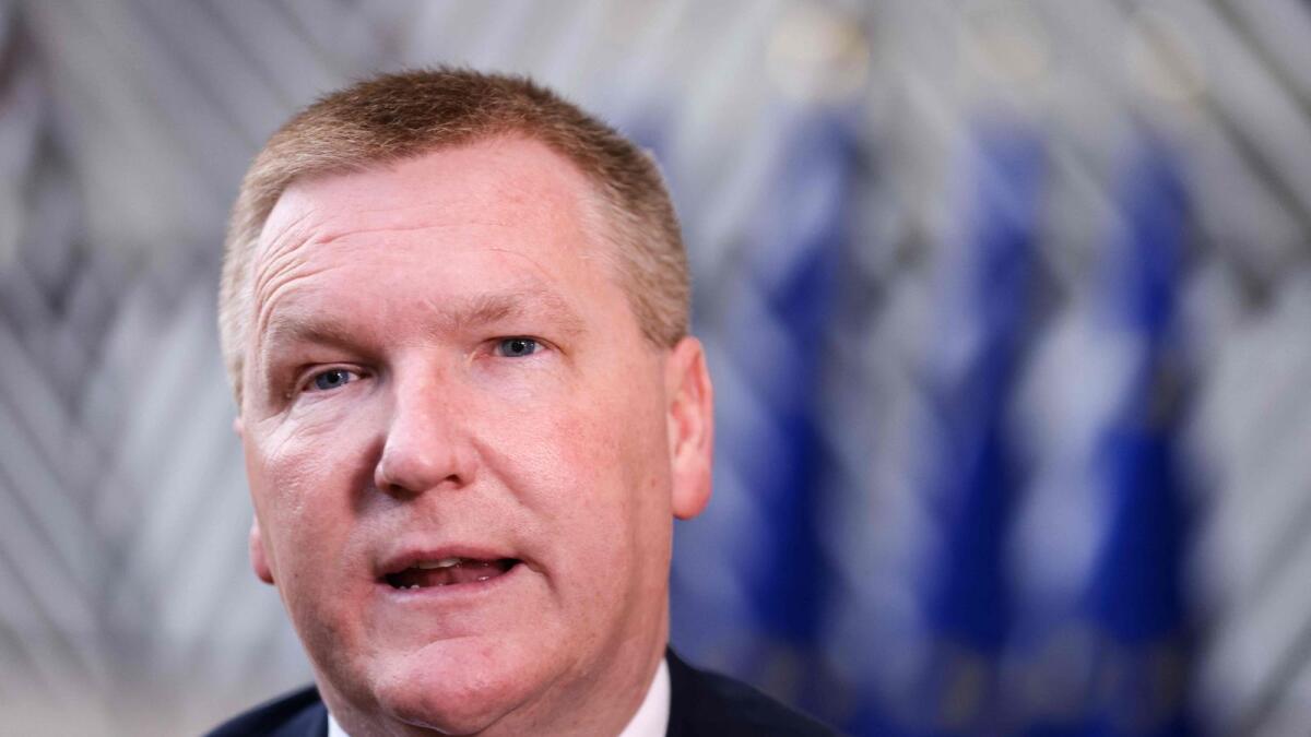 Ireland's Minister of Finance Michael McGrath speaks to the press as he arrives for the Eurogroup meeting at the EU headquarters in Brussels on March 13, 2023. — AFP file