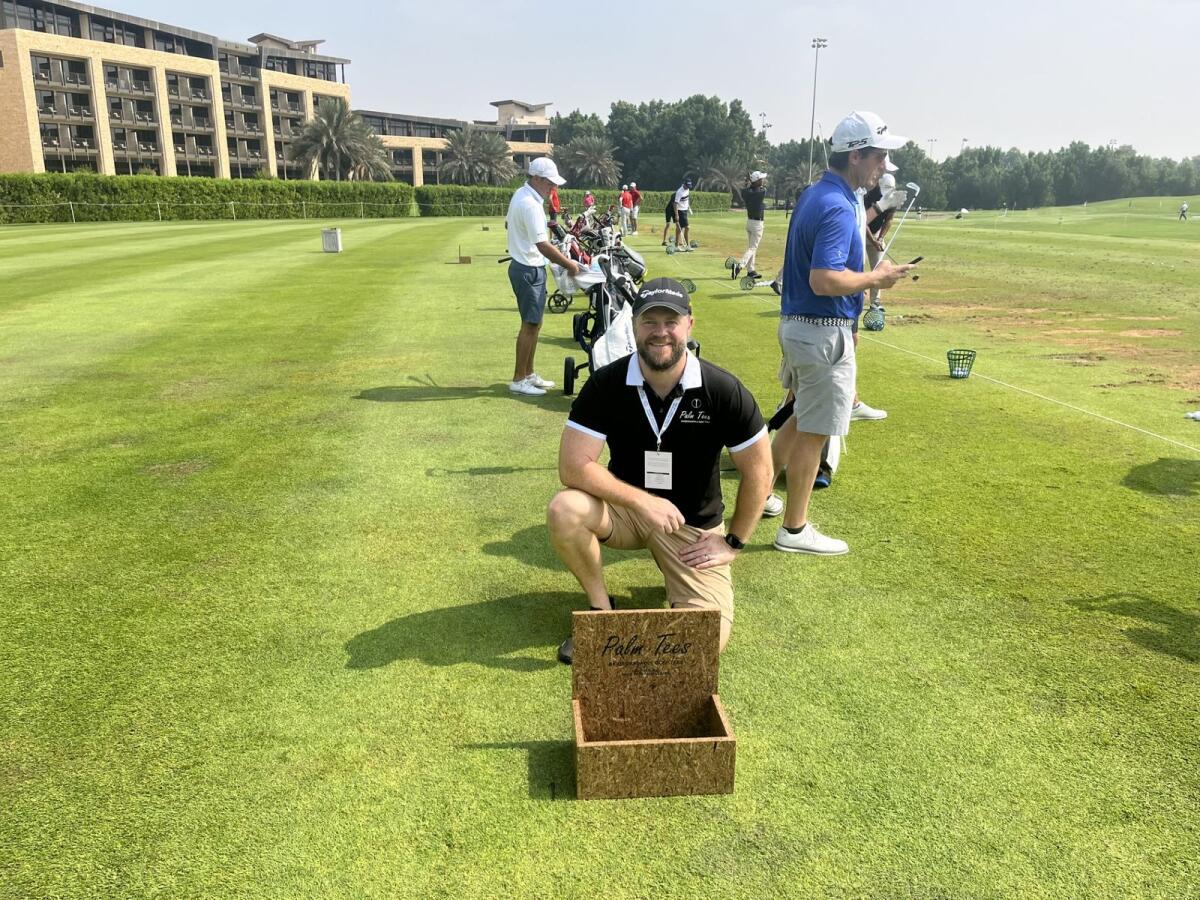 Co-founder of Palm Tees, Luke Roebuck, stock checking his Palm Tees box of Tees at the recent WATC on the Driving Range at Abu Dhabi Golf Club.- Supplied photo