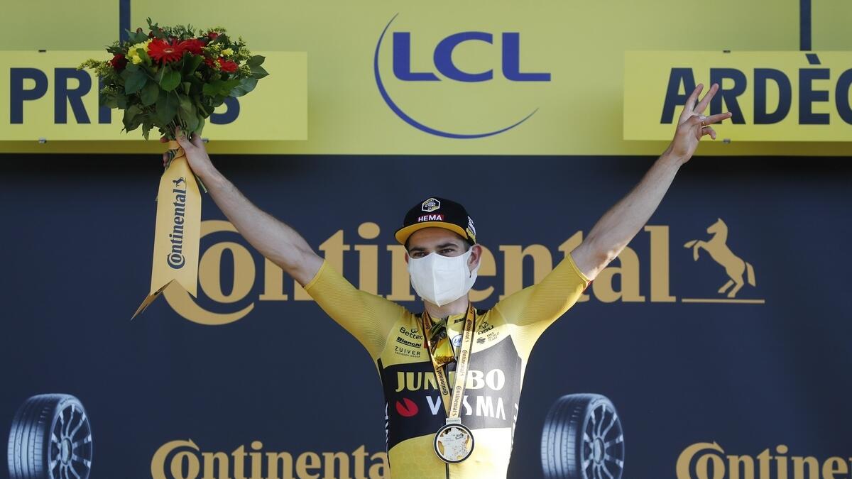 Team Jumbo-Visma rider Wout Van Aert of Belgium celebrates on the podium. - Reuters