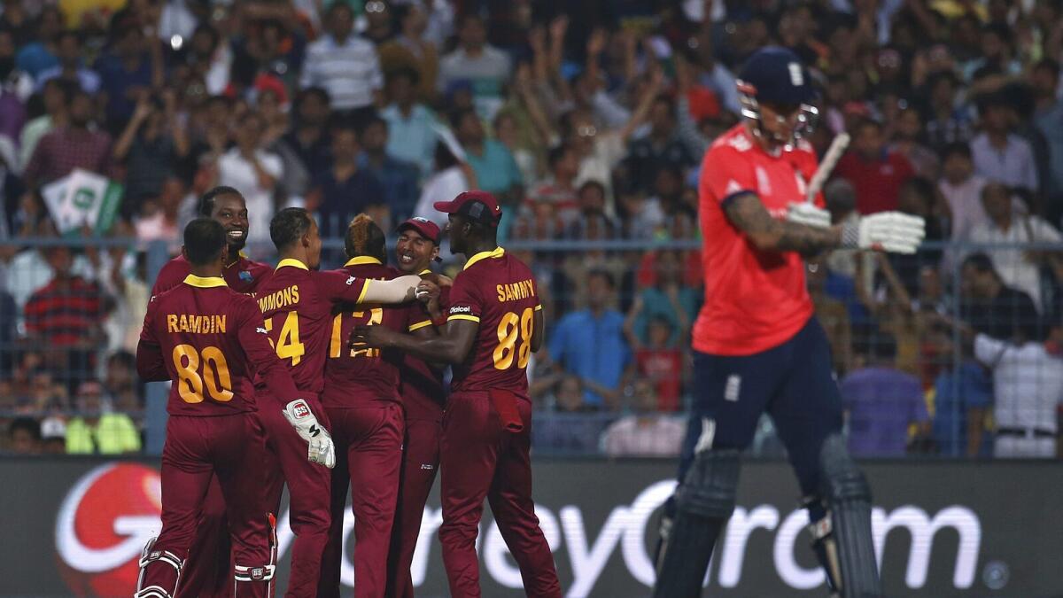 West Indies players celebrate the dismissal of England's Alex Hales.