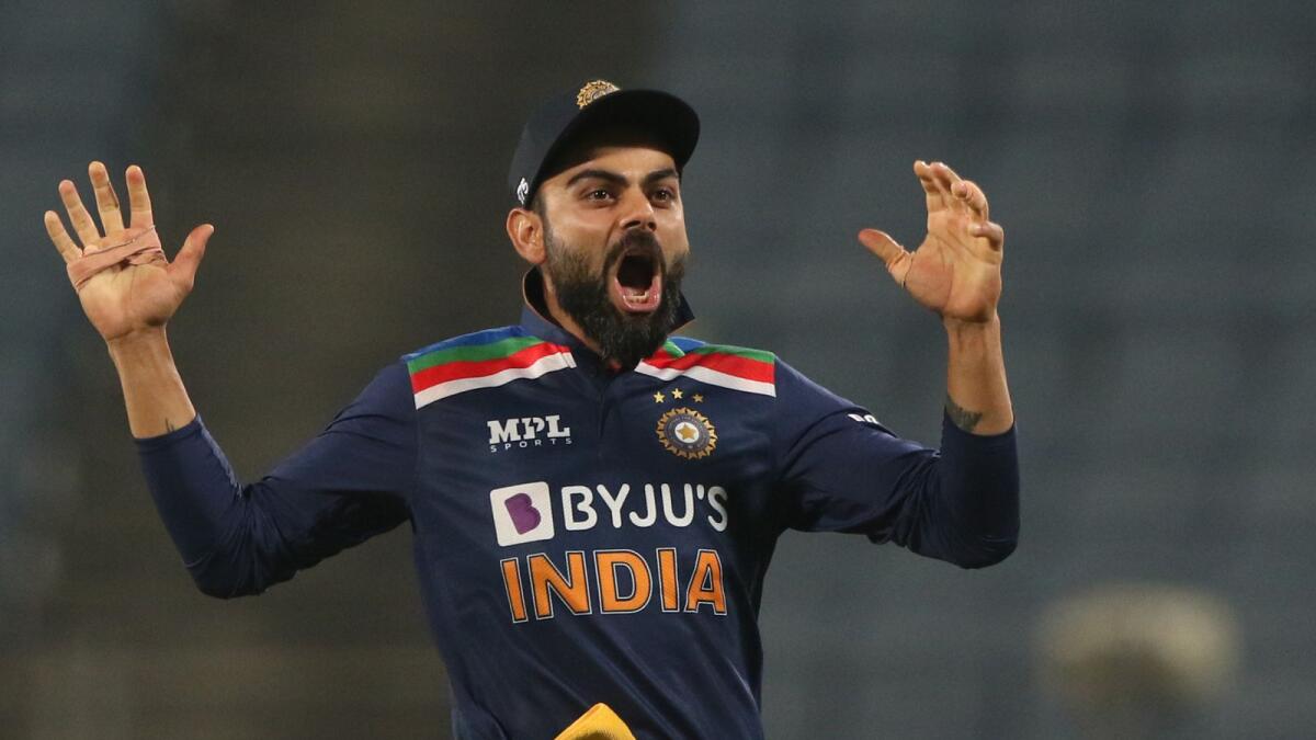 Virat Kohli celebrates the wicket of Jos Buttler during the first ODI between India and England. (BCCI)