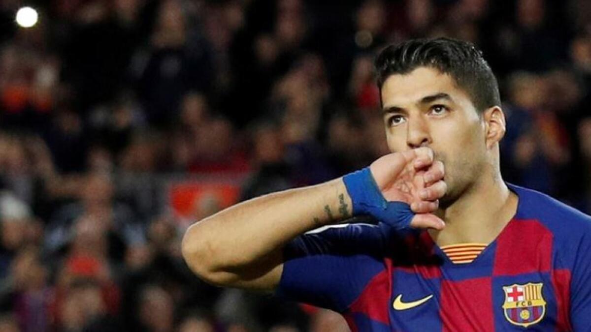 The Uruguay striker, who is Barca's third all-time top scorer with 198 goals in all competitions, had a year left on his contract with the club. (Reuters)