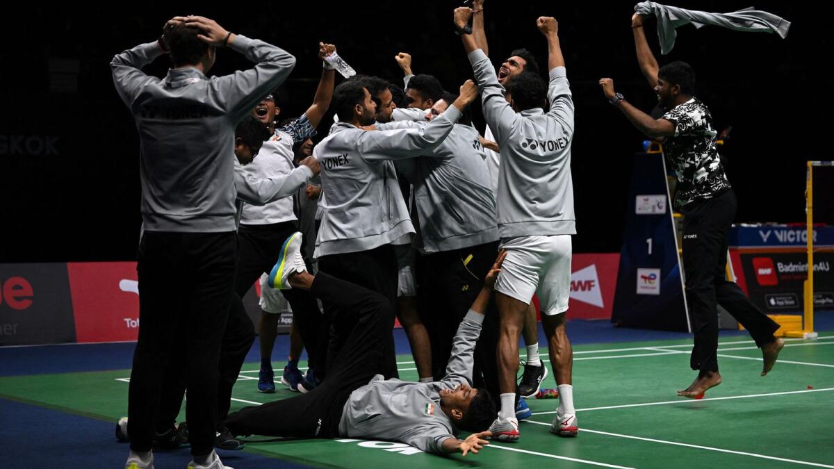 Members of the Indian men's badminton team celebrate their stunning win over Indonesia in the final of the Thomas Cup. (AFP)