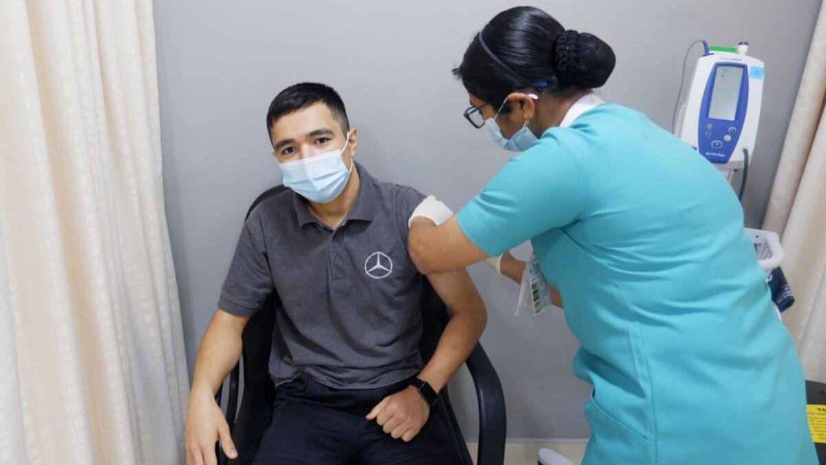 Faridun Egamov takes the second dose of Sinopharm vaccine. Photo: Supplied
