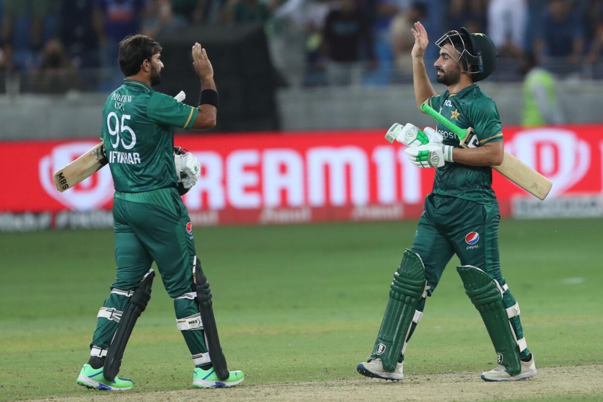 Pakistan's Khushdil Shah (R) celebrates with teammate Iftikhar Ahmed. Photo: AFP