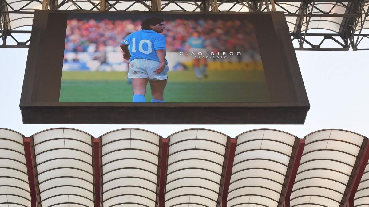 A photo of late Argentina football legend Diego Maradona is displayed prior to the Serie A match between AC Milan and Fiorentina. (AFP)