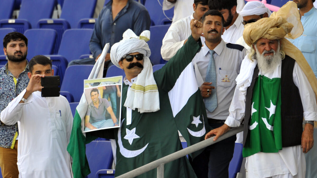 Pakistani fans cheering for their team during the Pakistan vs England test matchy at the Sheikh Zayed Stadium, in Abu Dhabi  - Photo By Nezar Balout/Khaleej Times