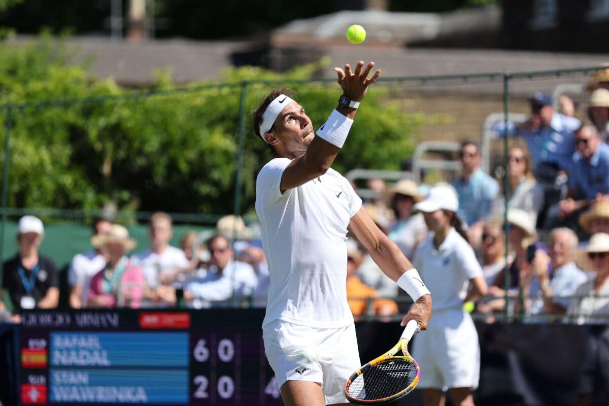Rafael Nadal serves during the match against Stan Wawrinka. (AFP)