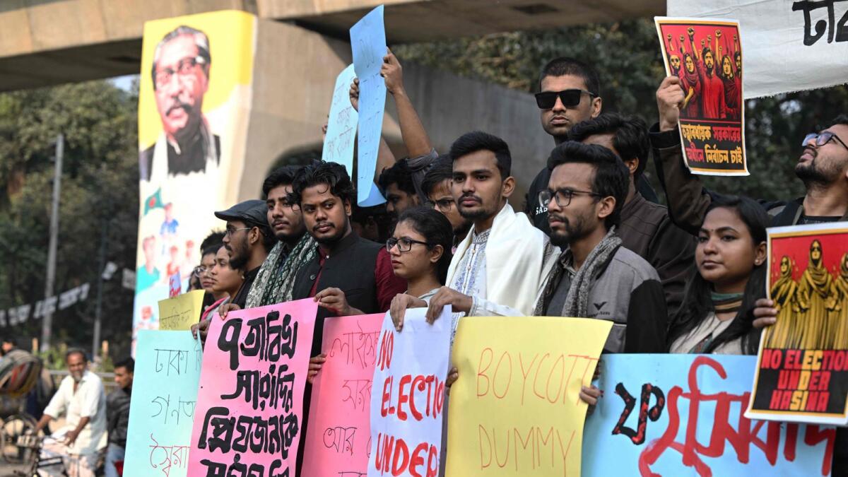 Dhaka University students hold a rally along a roadside in the capital, urging people to boycott Bangladesh's general elections. — AFP
