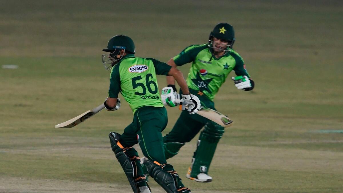 Babar Azam and Haider Ali run between the wickets. — AFP