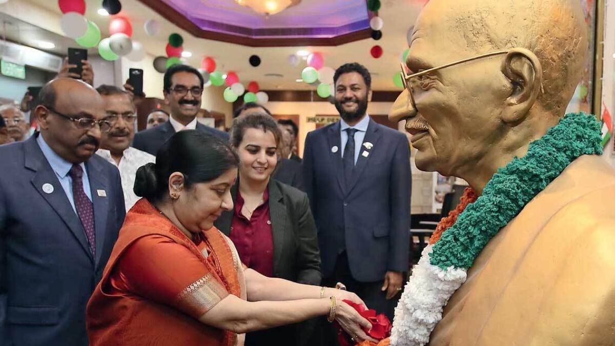Sushma Swaraj pays tribute in front of the statue of Mahatma Gandhi during her visit at the India Social Centre in Abu Dhabi on Tuesday. — Photo by Ryan Lim