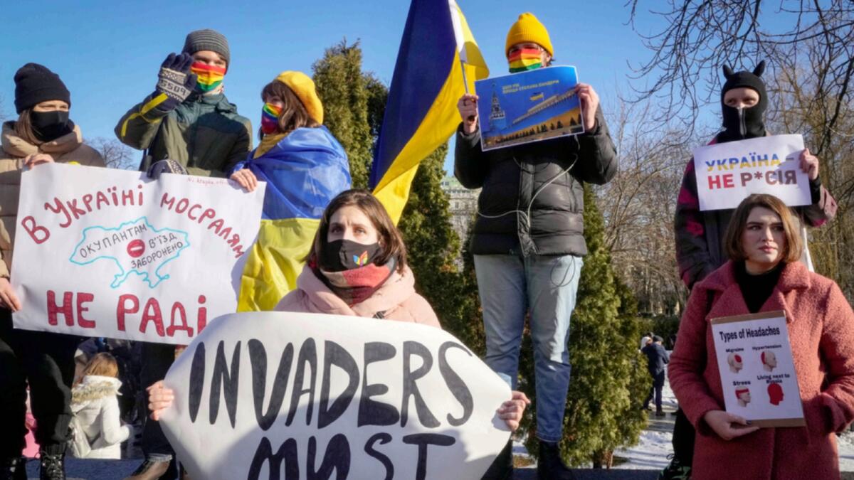 Ukrainian activists attend a rally in central Kyiv. — AP