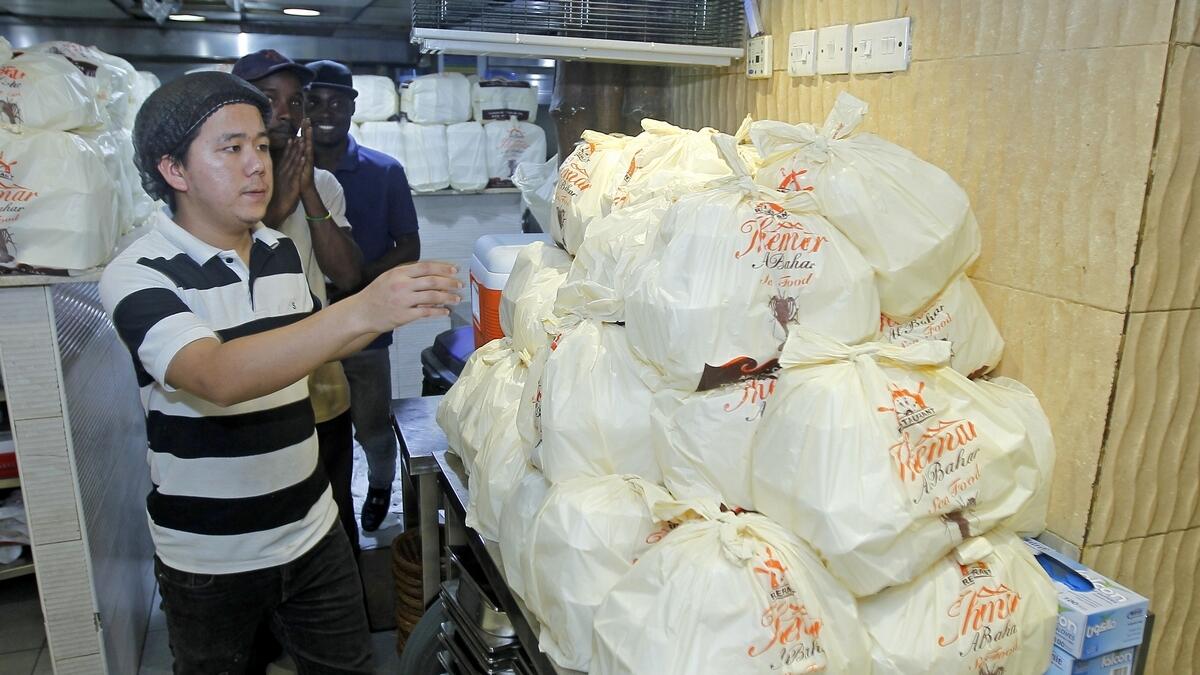 Expat distributes 450 free food boxes daily
