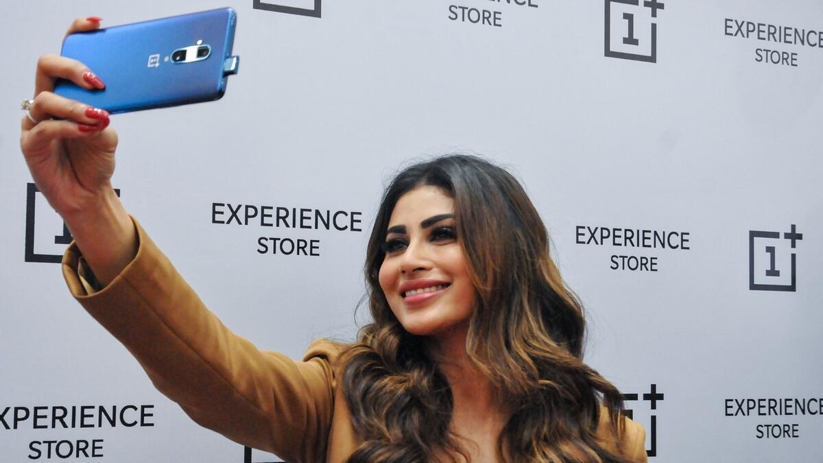 Mouni Roy takes a selfie at a promotional event in Kolkata.