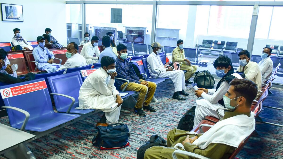 Stranded passengers after not meeting entry requirements atthe Dubai airport on Thursday.