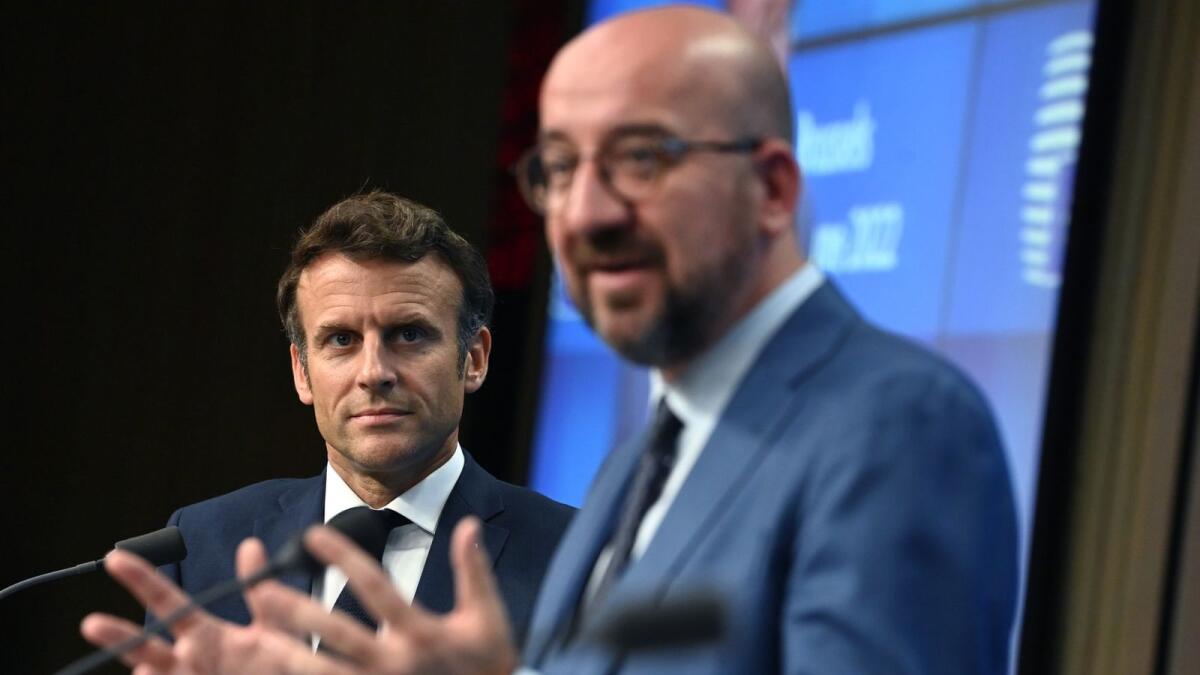 President of the European Council Charles Michel gestures next to France's President Emmanuel Macron after the European Council meeting in Brussels. – AFP