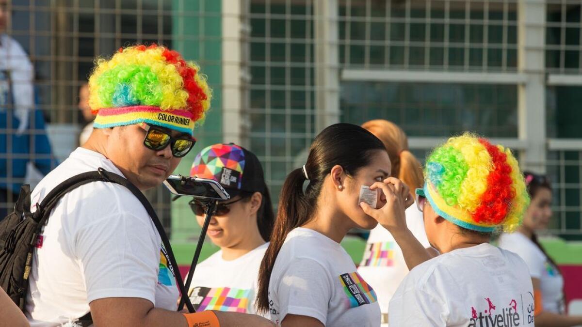 Participants dress up for the Color Run event at Dubai Autodrome. -Photo by Leslie Pableo/Khaleej Times
