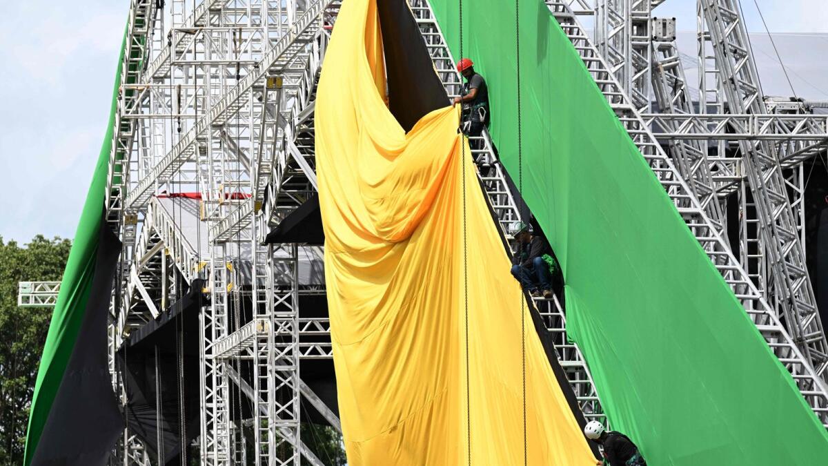 Workers set up the stage structure for the music festival that will be held on the inauguration day of Brazilian President-elect Luiz Inacio Lula da Silva at the Esplanade of Ministries in Brasilia on Tuesday. — AFP
