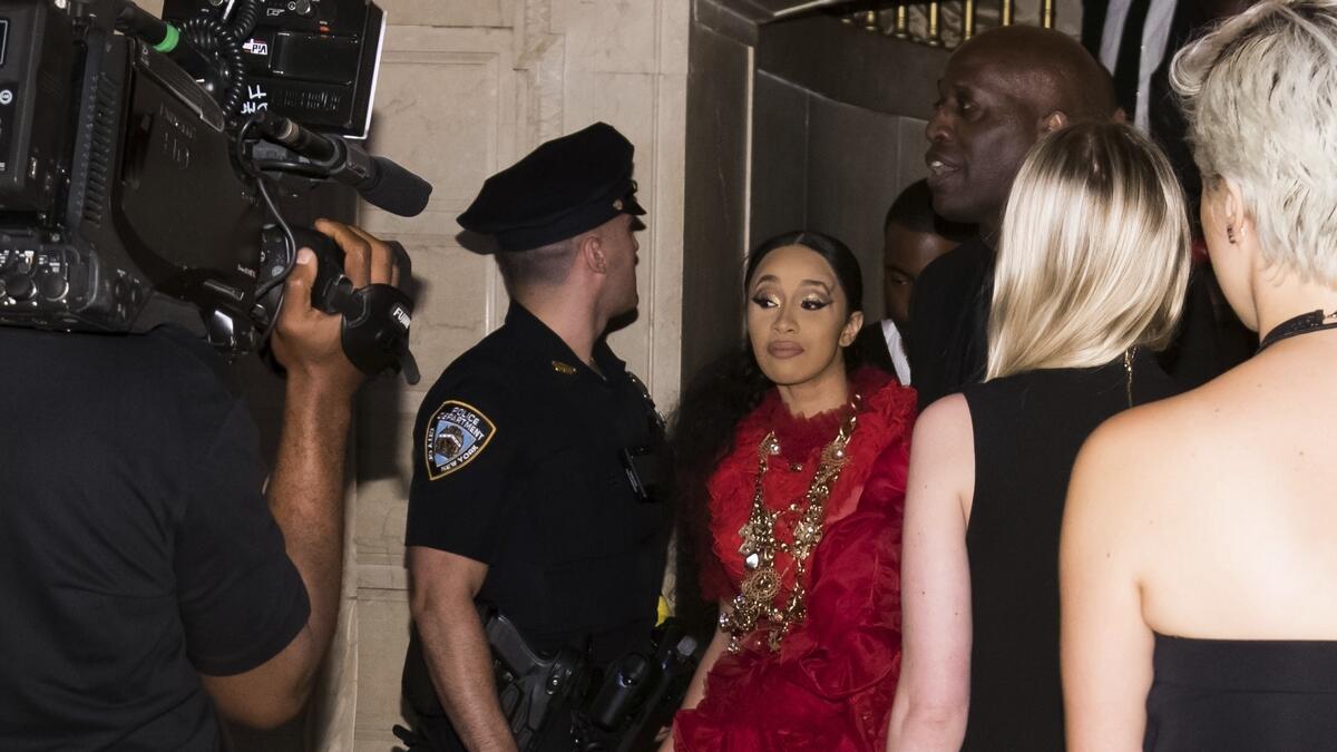 Cardi B, with a swollen bump on her forehead, leaves after an altercation at the Harpers BAZAAR 'ICONS by Carine Roitfeld' party at The Plaza in New York.-AP