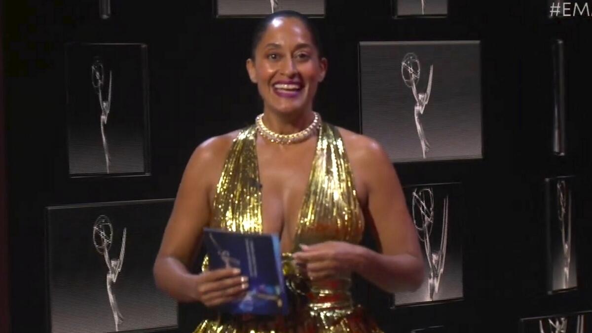 Nominee Tracee Ellis Ross oozed sex appeal in a gold Alexandre Vauthier gown cut down to there, and with a high central slit revealing her legs.