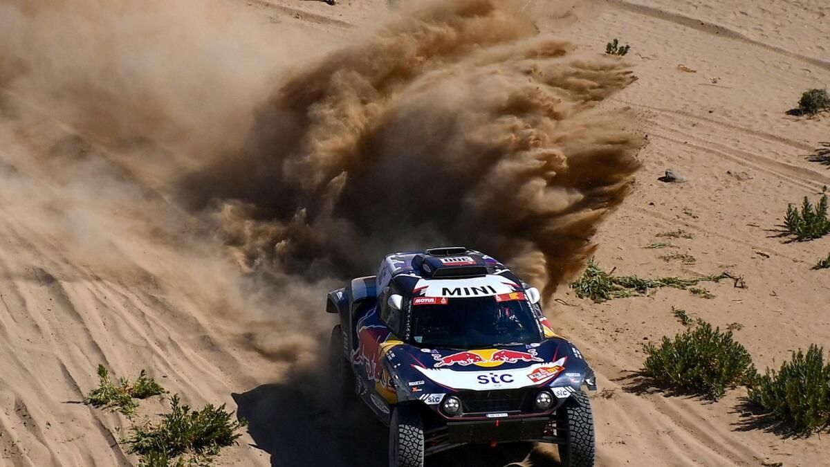 Mini’s Spanish driver Carlos Sainz and co-driver Lucas Cruz compete during Stage 1 of the 2021 Dakar Rally between Jeddah and Bisha in Saudi Arabia. — AFP