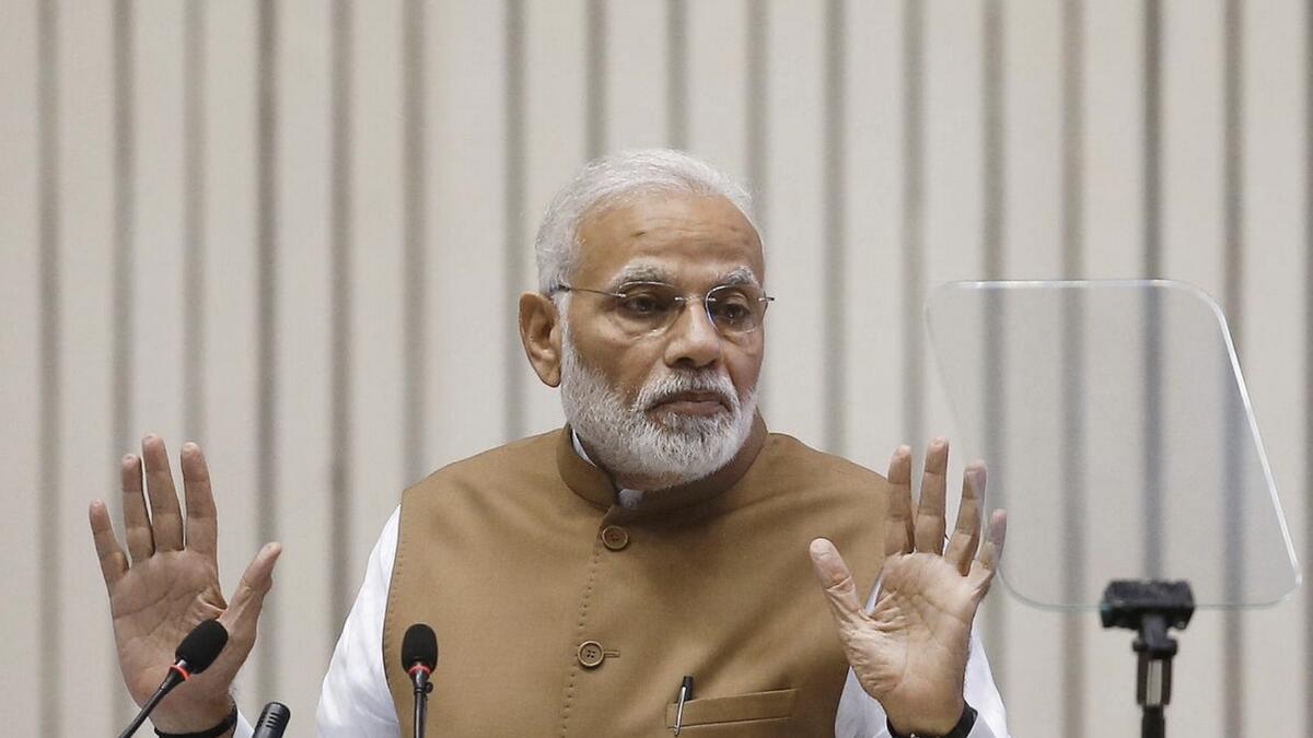 Modi asks ministers to reach office on time, avoid working from home