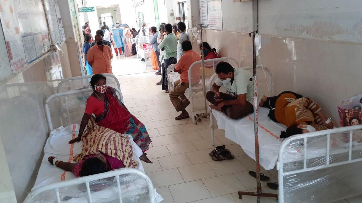 Patients and their bystanders are seen at the district government hospital in Eluru, Andhra Pradesh state, India.  - AP Photo