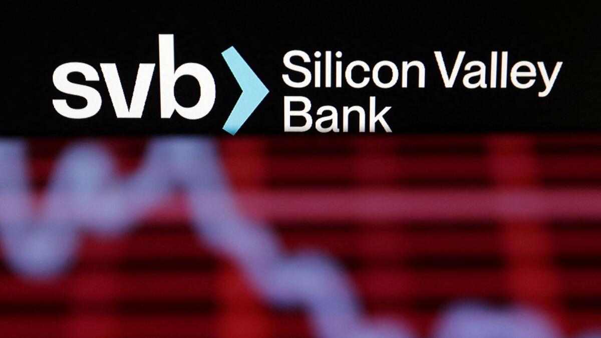 SVB (Silicon Valley Bank) logo and decreasing stock graph are seen in this illustration. - reuters