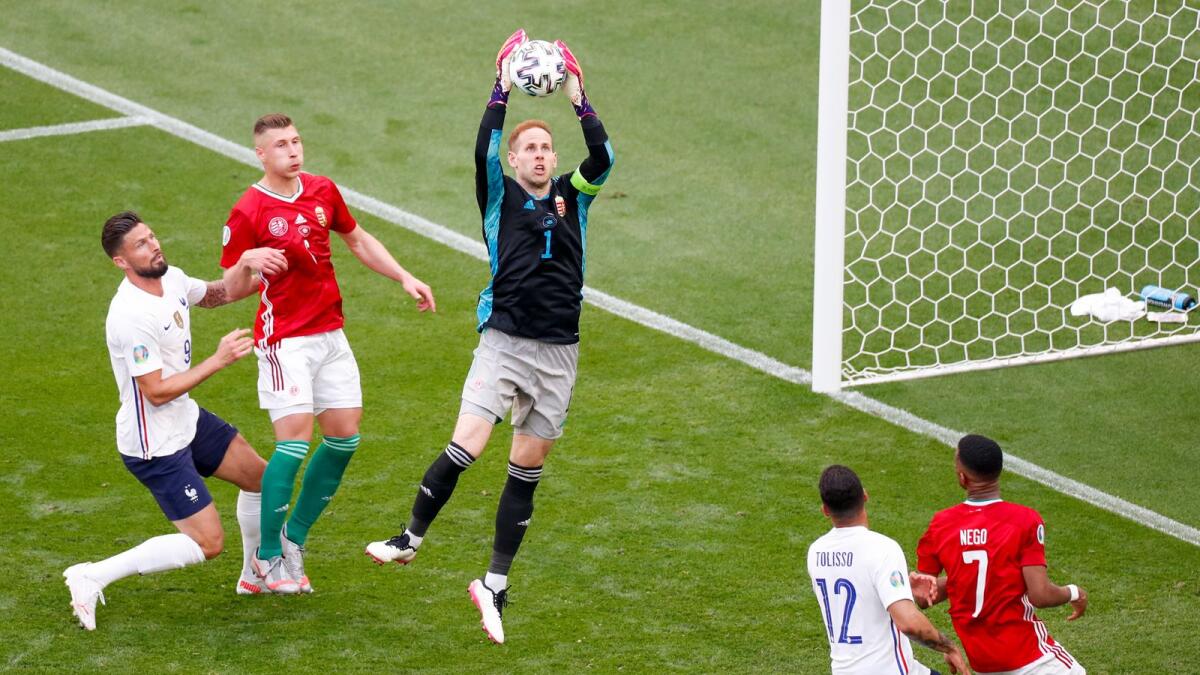 Hungary's goalkeeper Peter Gulacsi reaches up to take the ball during the Euro 2020  championship group F match between Hungary and France. — AP