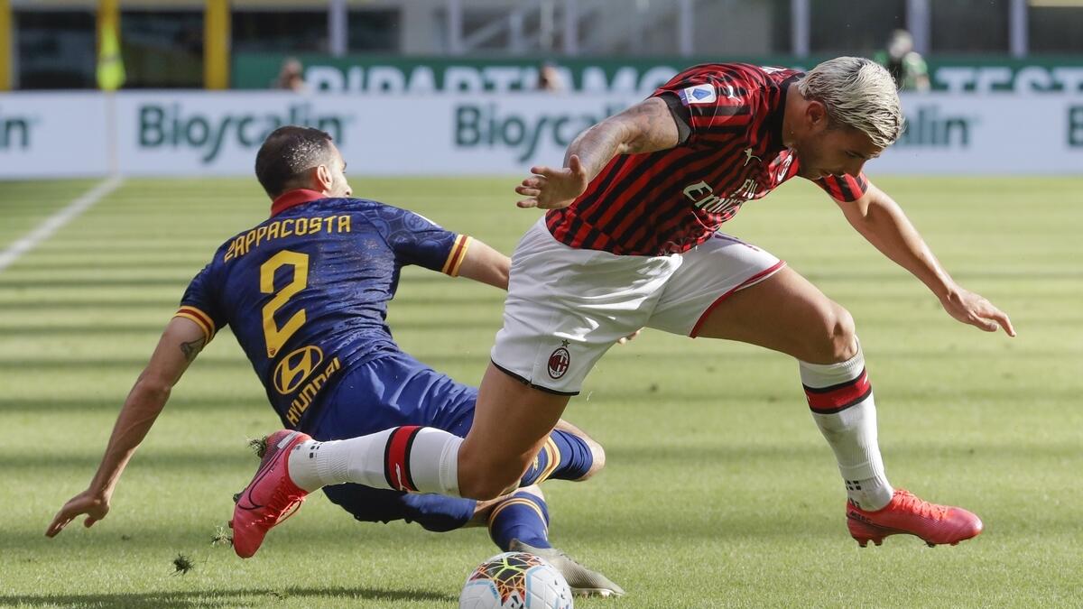 AC Milan's Theo Hernandez (right) and Roma's Davide Zappacosta vie for the ball
