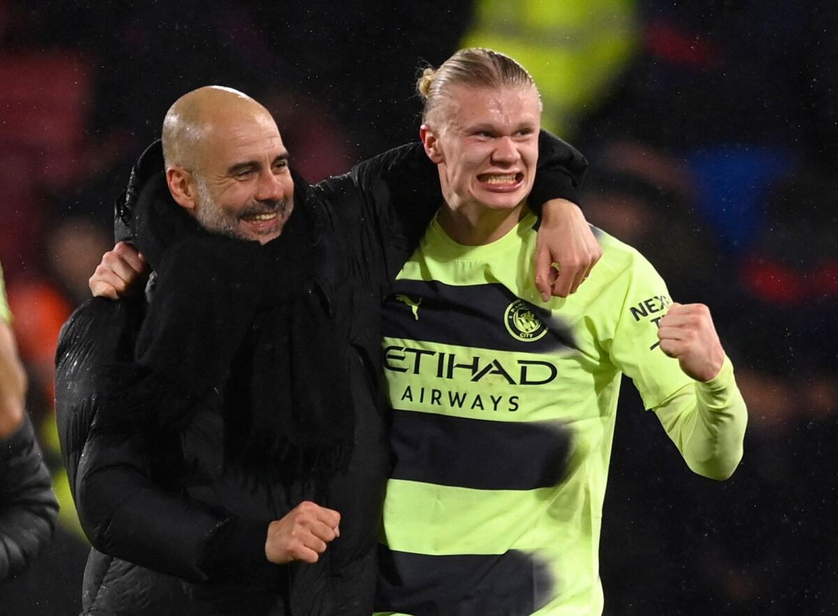 Manchester City manager Pep Guardiola (left) and Erling Haaland celebrate after the match. — Reuters