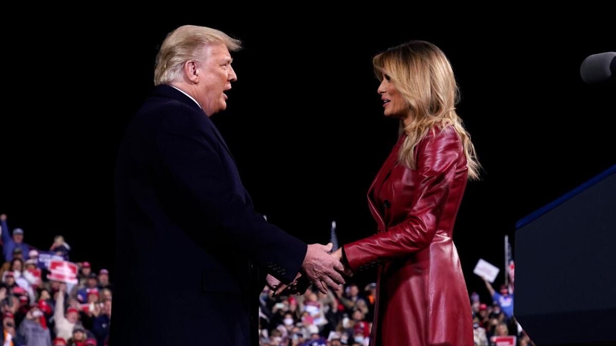 President Donald Trump greets first lady Melania Trump after she introduced him at a campaign rally for Senate Republican candidates. AP