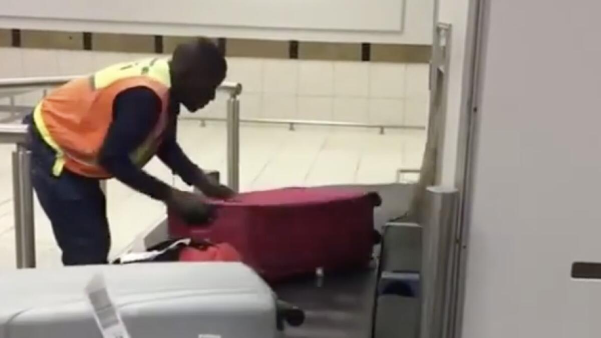 Video: Man organises airport luggage in hypnotic viral clip