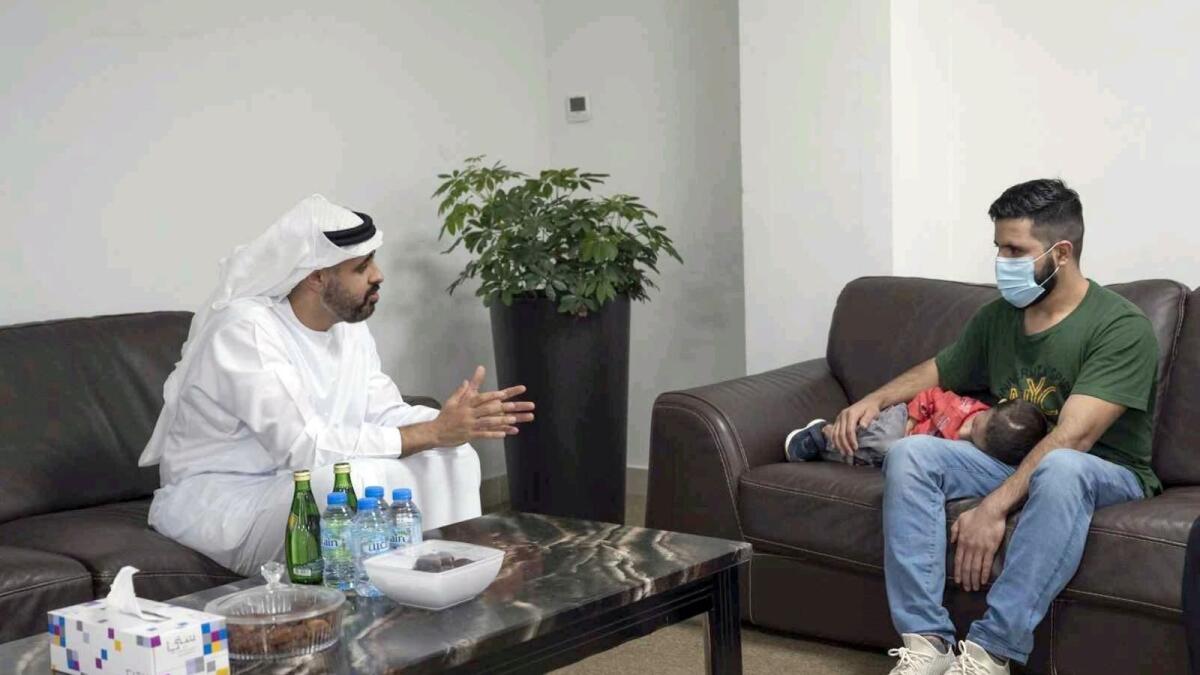 Sheikh Theyab bin Mohamed bin Zayed Al Nahyan with the child and his father