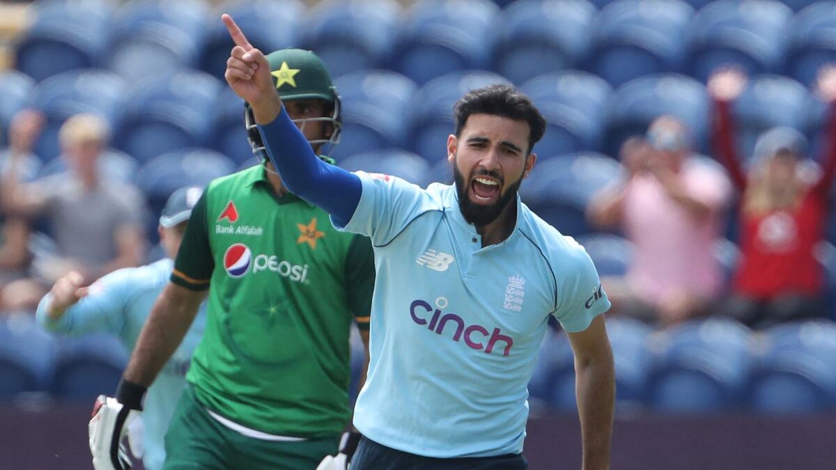 England's Saqib Mahmood celebrates taking the wicket of Pakistan's Babar Azam. (AFP)
