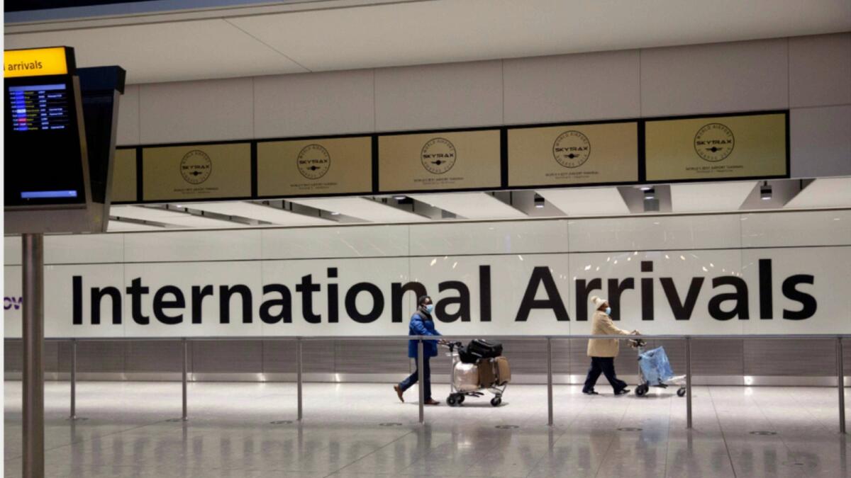 Passengers arriving at London Heathrow airport. — AP file