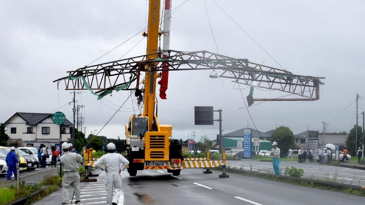 Japan typhoon grounds flights, injures three 