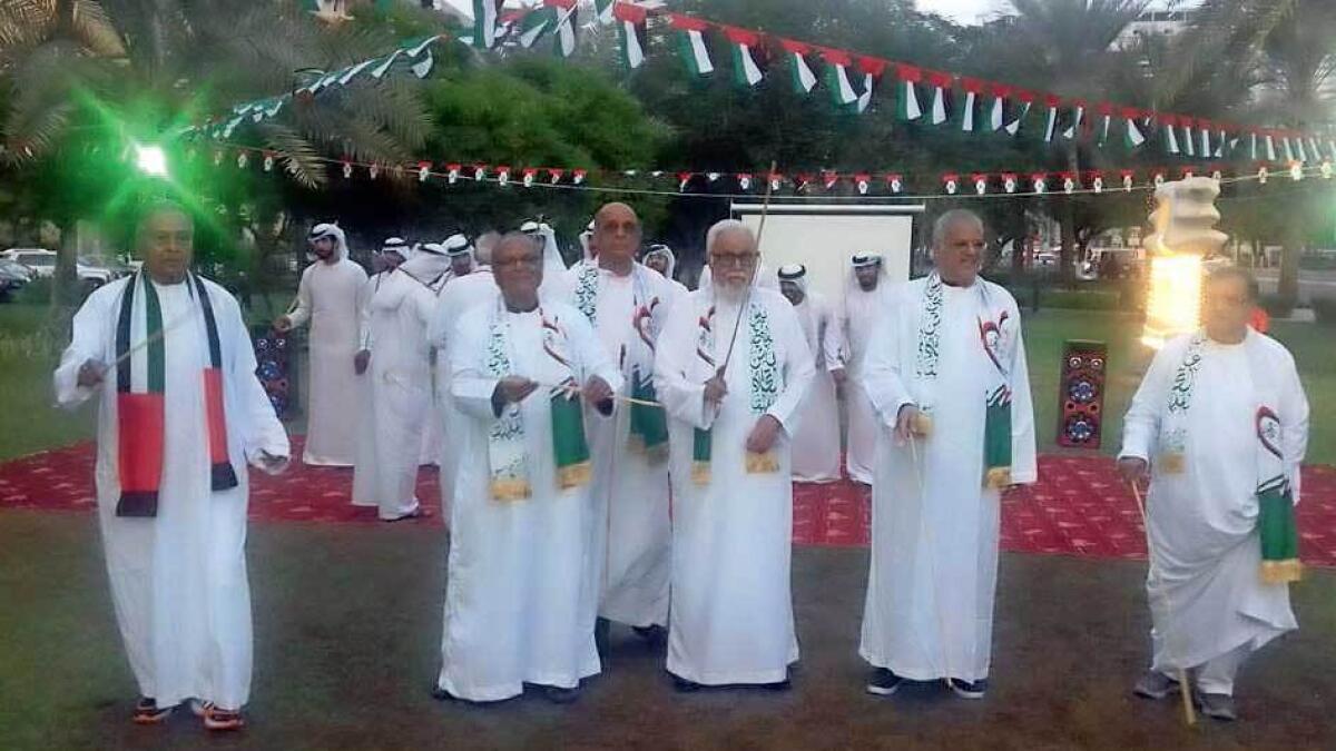 Donning Emirati outfits, senior expatriates mark the 47th National Day with traditional dances and local food. — Supplied photo