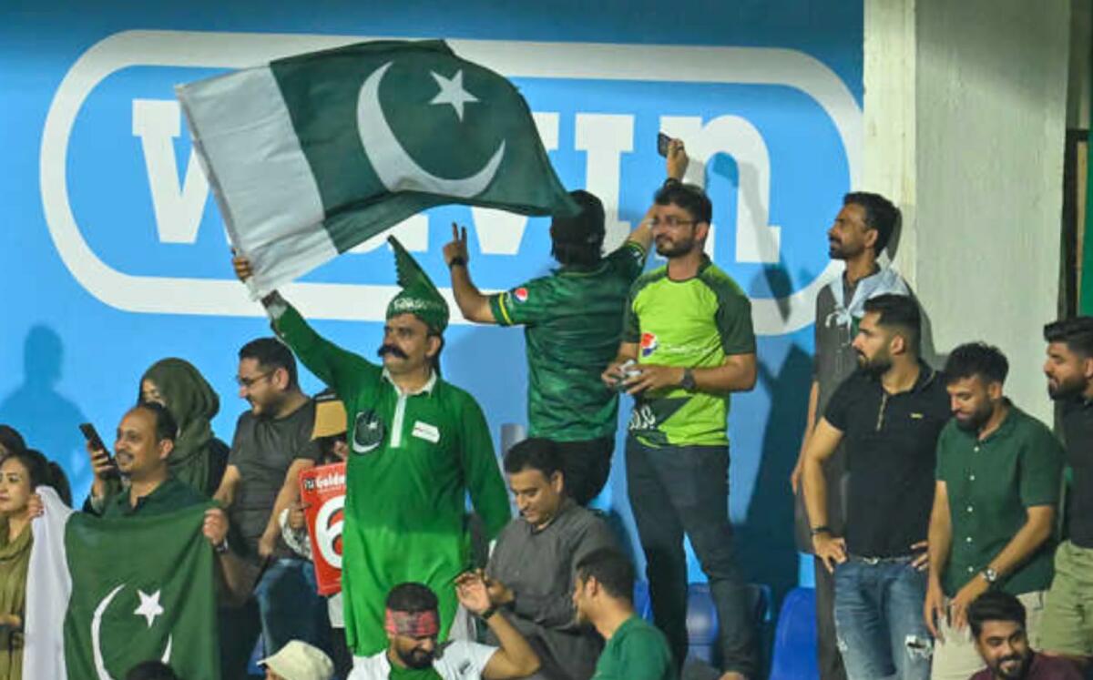 Pakistan fans cheer for their team